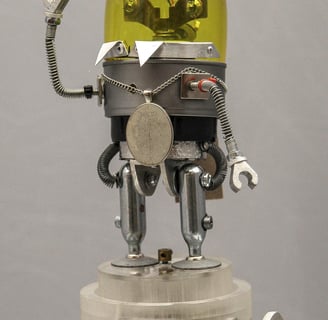 Hand-cranked retro robot model wearing a medallion