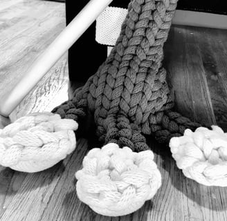 Closeup of FROG's foot, knit toes, knitting needles by Dundee & Lee's Emilie Odeile & Ken Chapin.