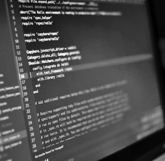 Monitor displaying code lines, highlighting expert software solutions for device issues at PC Medic