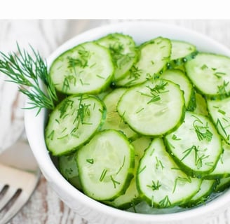 a cucumber salad on a bowl
