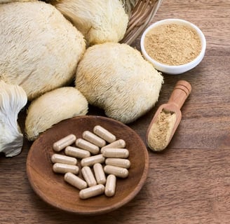 a bowl of mushrooms and pills on a table