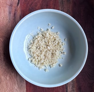 About 8-10 cloves of mined garlic