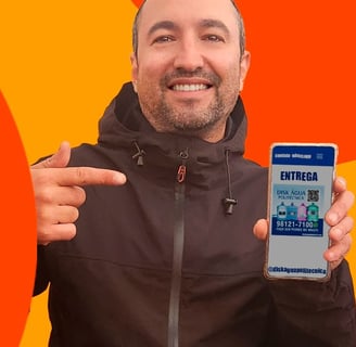 a man holding a cell phone in his hand