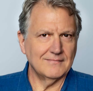 a man with a blue shirt and a tie