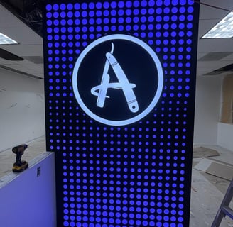 A iluminated sign with a letter A