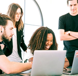 a group of people sitting around a table discussing on how to execute the work