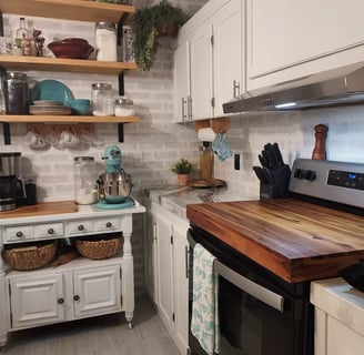 a kitchen with a stove top oven and a microwave