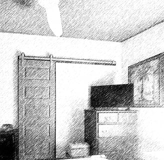 a bedroom with a bed and a television