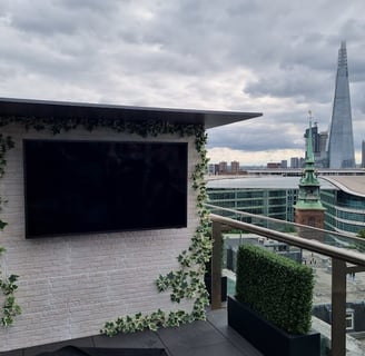 Samsung Terrace Outdoor TV mounted on a custom built media wall