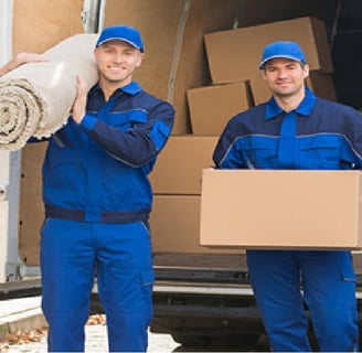 two men in blue uniforms carrying a large roll of paper towels