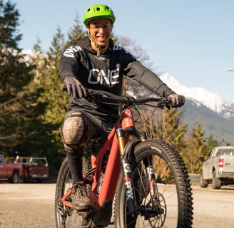a man riding a bike on a road