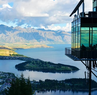 a view of a mountain range with a view of a lake and mountains