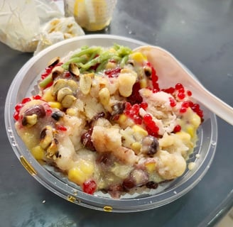 ice kacang, shaved ice with cendol grass jelly sweet corn beans and syrup
