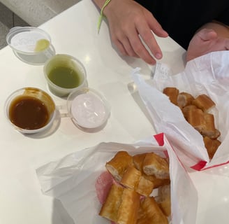 you tiao, a chinese snack. it's a fried dough with kaya and pandan dip on the side