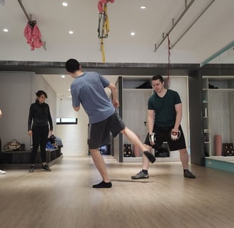 Practicing striking on the focus mitts.