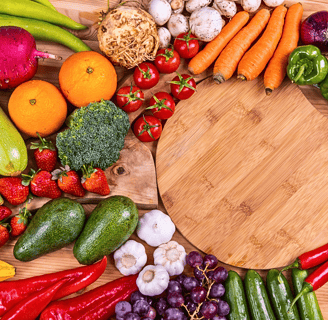 a wooden cutting board with vegetables and vegetables