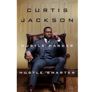 a man in a suit and tie sitting in a chair