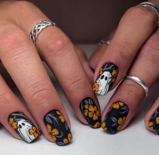 "Spooky Halloween press-on nails featuring vibrant designs and festive colors perfect for adding fla