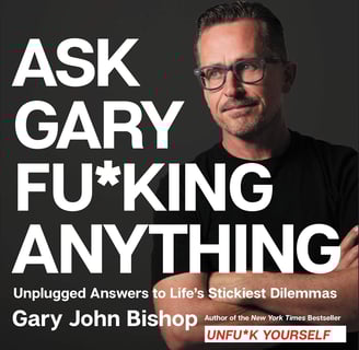 a man with glasses and a black shirt with the words ask, ask, ask