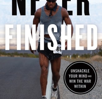 a man in a tank top running on a road