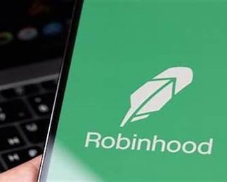 a person holding a phone with a robinhood logo on it