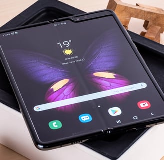 a samsung galaxy note 8 pro with a butterfly on top of it