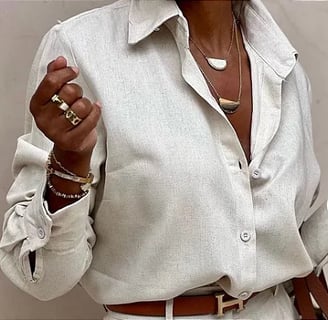 a woman in a white shirt and white pants