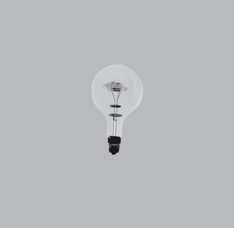 Illustration d’une ampoule en verre éteinte (grillée) sur fond gris.