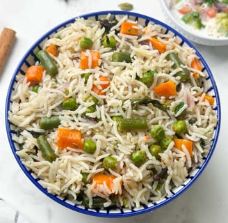 Vegetable Pulao, a fragrant, one-pot rice dish cooked with a medley of fresh vegetables & spices.