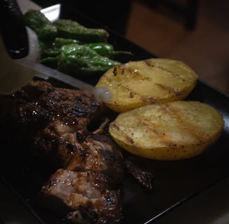 a plate of food with potatoes and potatoes on it
