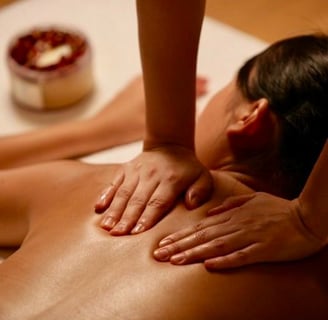 a woman getting a massage at a spa