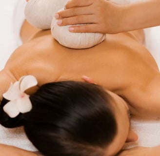 a woman getting a massage at a spa