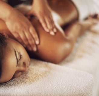 a woman getting a massage at a spa