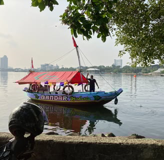 man on boat Ancol beach Jakarta