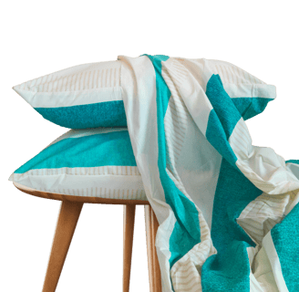 a stack of pillows and a bedsheet on a stool - cotton bedsheet
