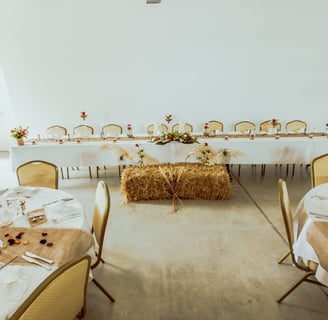 a table with hay bale and hay bale