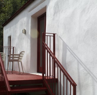 A private balcony with seating
