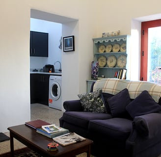 The living room with double doors to balcony