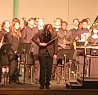 Noah Lathrop conducting wind ensemble