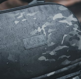 a black and white camouflage backpack with a camouflage print