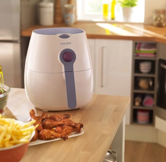 a kitchen counter top with a bowl of fries and a bowl of fries, first look the Phillips Airfryer