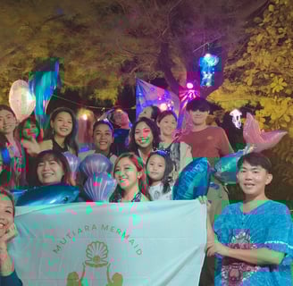 the Jakarta mermaid pod celebrating a birthday and all posing for a group picture