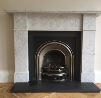 a fireplace with a fireplace in a room