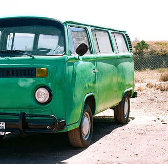 an old green Volkswagon minivan