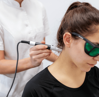 Laser therapy on patient's neck