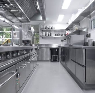 a kitchen with stainless steel appliances and stainless steel appliances