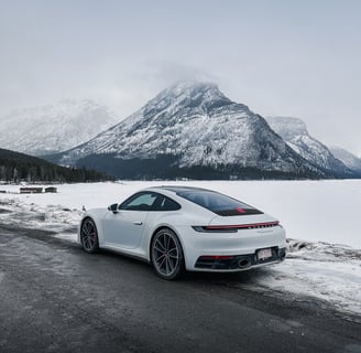 white Porsche panamera on the snow
