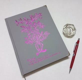 a book with a drawing of a hand holding a book