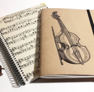 a notebook with a violin and a violin