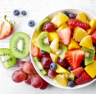 a bowl of fruit and fruit juice